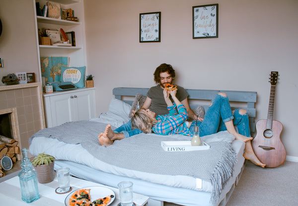 girl and boy eating vegan pizza